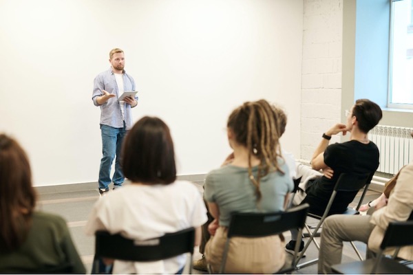 man speaking to audience